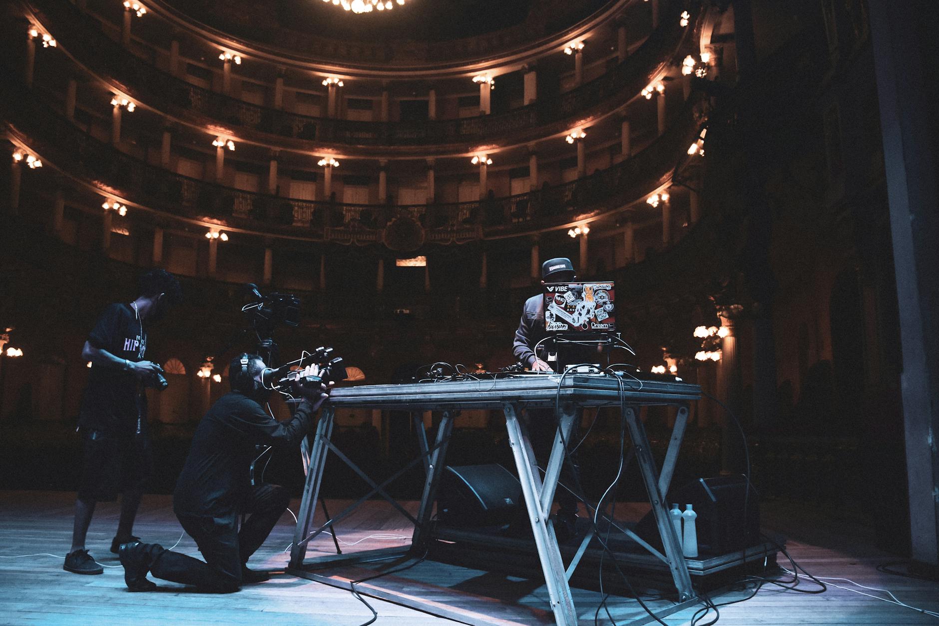 Musicians performing on stage in a grand theater venue